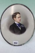 AN UNUSUAL GERMAN K.P.M.OVAL PORCELAIN PORTRAIT OF A YOUNG MAN WITH IMPRESSED MARK