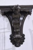 A VICTORIAN CARVED OAK WALL BRACKET