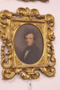 A 19TH.C.OIL ON PANEL PORTRAIT OF A GENTLEMAN IN CARVED GILTWOOD FRAME