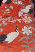 A CHINESE SILKWORK COVERLET AND TWO PILLOW CASES, OVERALL CRANES AND LILY DECORATION.