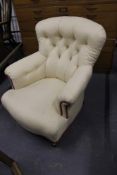 A VICTORIAN BUTTON BACK ARMCHAIR