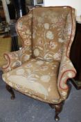 A GOOD GEO.I.STYLE WING BACK ARMCHAIR WITH NEEDLEPOINT UPHOLSTERY