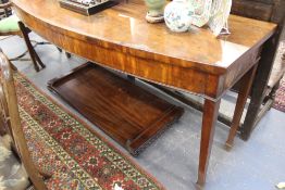 A LARGE GEORGIAN MAHGOANY BOW FRONT SERVING TABLE