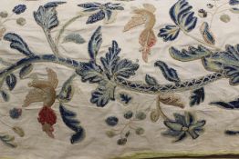 A CREWEL WORK ON LINEN PANEL, BIRDS AMIDST FOLIAGE AND FLOWERS.
 
approx 119 x54 cm