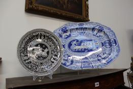 A 19TH.C.BLUE AND WHITE PLATTER WITH GRECIAN CHARIOT AND INTERIOR SCENES TOGETHER WITH A LATER SPODE