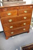 A REGENCY MAHOGANY AND INLAID CHEST OF DRAWERS