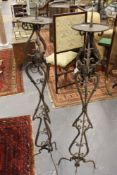 A PAIR OF ANTIQUE WROUGHT IRON FLOOR STANDING PRICKET CANDLESTICKS