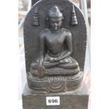 AN EARLY INDIAN CARVED STONE FIGURE OF A SEATED BUDDHA