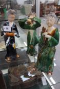 A GROUP OF THREE TANG STYLE STANDING FIGURES OF MUSICIANS.