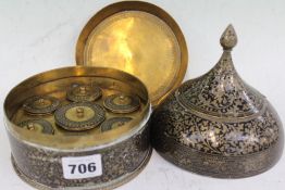 AN INDIAN BRASS AND ENAMEL COLOURED CONDIMENT SET.