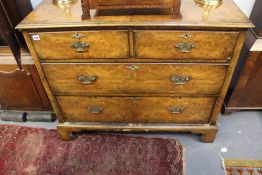 A 19TH.C.WALNUT CHEST OF TWO SHORT AND TWO LONG DRAWERS ON BRACKET FEET