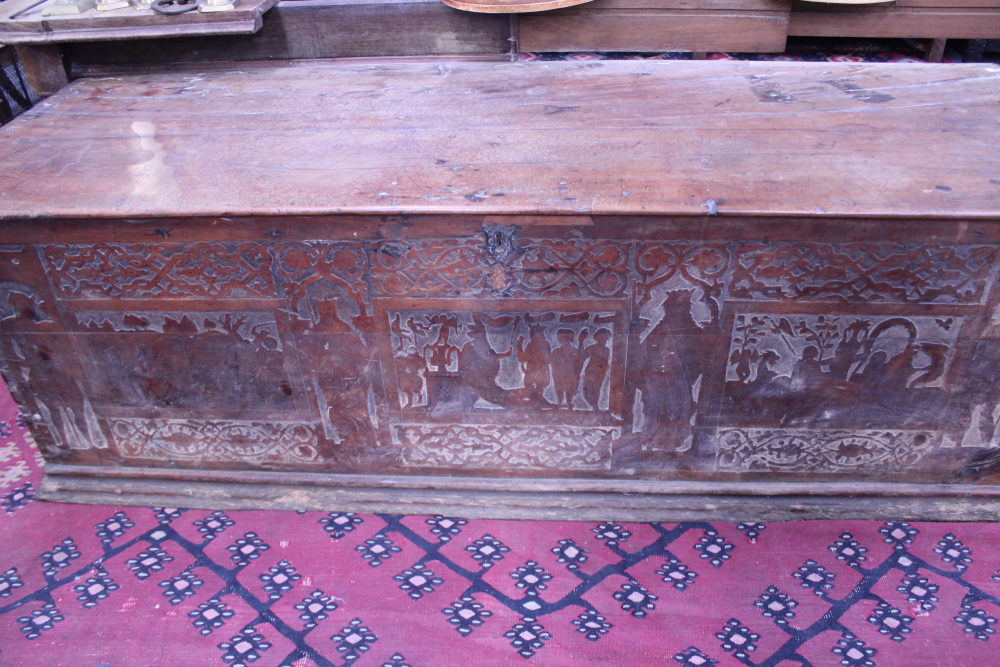 AN EARLY CONTINENTAL CEDAR PLANK CASSON WITH SHALLOW CARVED AND PENWORK DECORATED FRIEZE