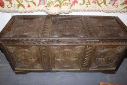 AN 18TH.C.AND LATER OAK COFFER WITH CARVED DECORATION