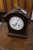 AN EDWARDIAN OAK BRACKET CLOCK WITH STRIKING MOVEMENT