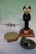 A VINTAGE CAST ALLOY FIGURE OF ANDY CAPP TOGETHER WITH A CHROME AND PERSPEX MODEL OF A FLYING