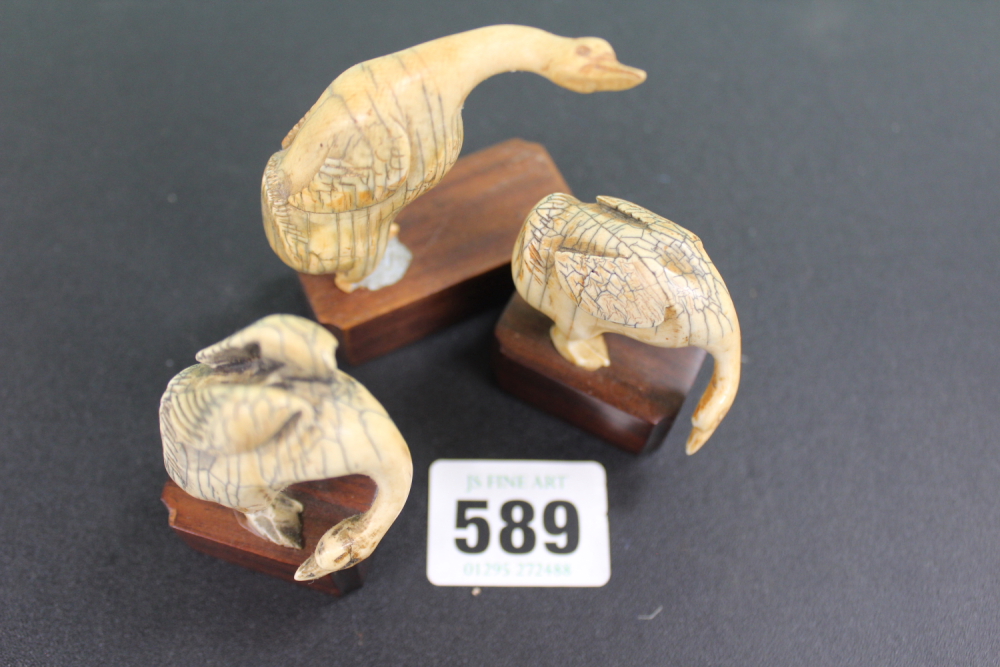 THREE ANTIQUE CARVED IVORY GEESE