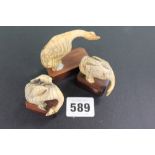 THREE ANTIQUE CARVED IVORY GEESE