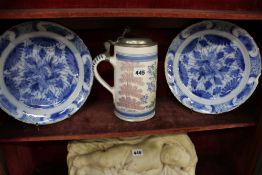 A DELFT TANKARD AND TWO BLUE AND WHITE DELFT PLATES