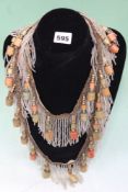 AN INTERESTING BEADED FRINGE TOGETHER WITH FURTHER CARVED HARDSTONE BEADS,ETC