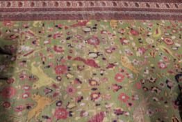 AN ANTIQUE PERSIAN CARPET OF HUNTING DESIGN
POOR CONDITION- ALMOST NO PILE TO 80% OF THE FACE