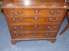 A Georgian solid rosewood and boxwood strung small chest of four graduated drawers