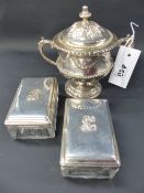A silver gilt hallmarked Georgian style twin handle covered cup decorated with swags and leaves