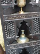 Four Indian pieces of metalware, A hookah base, an elephant supported bowl,etc