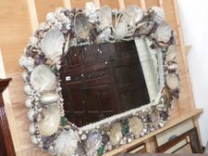 A large and impressive shell surmounted framed mirror