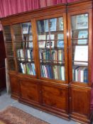 A Geo.III fruitwood breakfront bookcase with glazed upper over a four door base