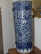 A Chinese blue and white umbrella/stick stand, flower heads and scrolling foliage