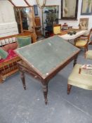 A Victorian oak artists table with end drawer and rising top