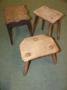 Two antique pine rustic stools and an oak example