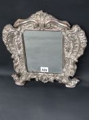 A Continental 900 Italianate rococo style mirror with scrolling foliate frame