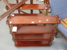 A pair of Victorian style four tier mahogany wall shelves with brass supports