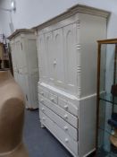 A large Victorian painted press cupboard on chest