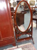A late Victorian mahogany cheval mirror