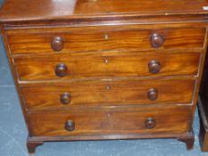 An early 19th.c.mahogany small chest of four graduated drawers and upper washstand slide