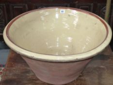 A large glazed pottery dough proving bowl