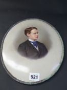 An Antique Berlin K.P.M porcelain oval plaque. Portrait of a young gentleman. Brass mount