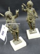 A pair of Antique gilt winged Italiante Putti on marble bases