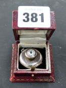 A rare and unusual silver cased button hole watch