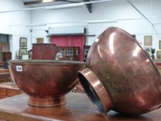A pair of large copper bowls