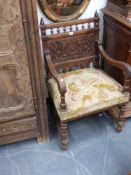 A pair of continental carved walnut armchairs