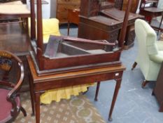 AGeo.III mahogany fold over tea table on slender turned legs with club feet together with a