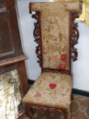 A Victorian prie dieu chair with needlepoint upholstery and a similar side chair