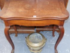 A 19th.c.colonial teak fold over card table on shaped and carved cabriole legs labelled Jhanda &