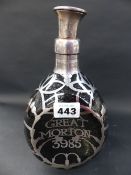 A silver overlaid Haig whiskey decanter of dimpled form. Inscribed Great Morton 3985. Hallmarked