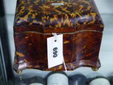 An early Victorian tortoise shell two compartment tea caddy of shaped form