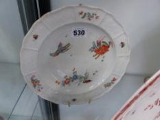 An early Meissen plate decorated with Oriental style animals, insects and flowers. Moulded basket