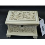 A well carved Cantonese ivory casket the top with writhing dragons, the sides decorated with